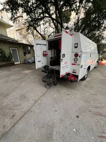 Magnet Plumbing service vehicle on-site for Grease Trap Cleaning in Harvey