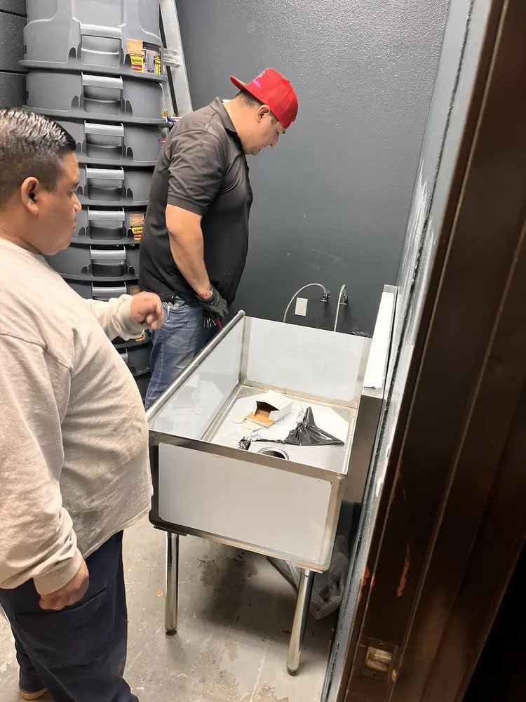 Commercial plumbing and sink installation in Harvey